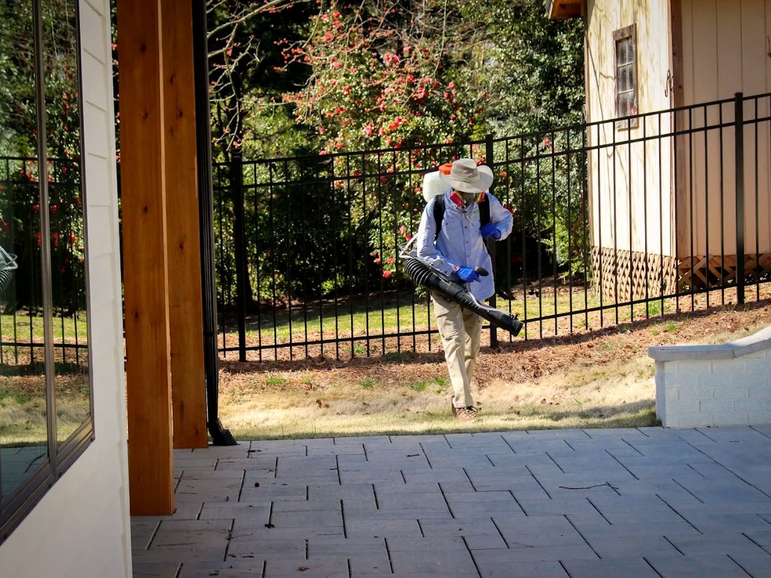 A Buzz Off technician treating the backyard of an Atlanta home